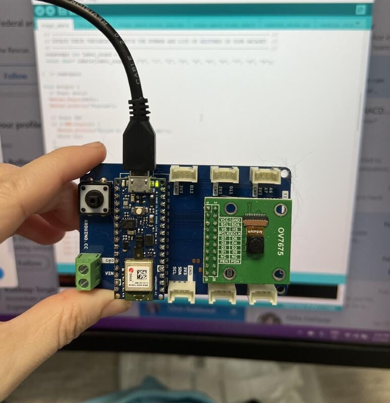 Kim Boher holding an assembled TinyML rig with Arduino Nano 33 BLE Sense